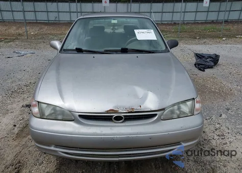 1999 Toyota Corolla Le z USA, uszkodzony, nr VIN 1NXBR12E3XZ238937